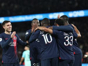 Paris Saint-Germain's French midfielder #33 Warren Zaire-Emery celebrates scoring his team's second goal with Paris Saint-Germain's French forward #10 Ousmane Dembele and teammates during the French L1 football match between Paris Saint-Germain (PSG) and Montpellier Herault SC at The Parc des Princes Stadium in Paris on November 3, 2023. (Photo by FRANCK FIFE / AFP)