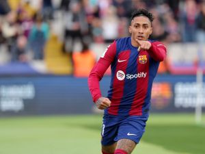 Barcelona's Brazilian forward #11 Raphinha celebrates scoring his team's first goal during the Spanish league football match between FC Barcelona and Getafe CF at the Estadi Olimpic Lluis Companys in Barcelona on February 24, 2024. (Photo by LLUIS GENE / AFP)