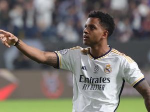 Real Madrid's Brazilian forward #11 Rodrygo celebrates after scoring his team's fourth goal during the Spanish Super Cup final football match between Real Madrid and Barcelona at the Al-Awwal Park Stadium in Riyadh, on January 14, 2024. (Photo by Fayez NURELDINE / AFP)