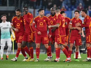 Roma's Argentine forward #21 Paulo Dybala (2R) is congratulated by teammates after scoring Roma's first goal during the UEFA Europa League last 16 first leg football match between AS Roma and Brighton and Hove Albion at the Olympic Stadium in Rome on March 7, 2024. (Photo by Andreas SOLARO / AFP)