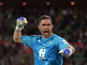 Real Betis' Chilean goalkeeper Claudio Bravo celebrates his team's first goal scored by Real Betis' Spanish forward Borja Iglesias during the Spanish Copa del Rey (King's Cup) final football match between Real Betis and Valencia CF at La Cartuja Stadium in Seville, on April 23, 2022. (Photo by CRISTINA QUICLER / AFP)