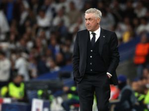 Real Madrid's Italian coach Carlo Ancelotti gestures on the sidelines during the UEFA Champions League quarter final first leg football match between Real Madrid CF and Manchester City at the Santiago Bernabeu stadium in Madrid on April 9, 2024. (Photo by Pierre-Philippe MARCOU / AFP)