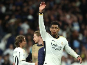 Real Madrid's English midfielder #5 Jude Bellingham reacts at the end of the UEFA Champions League quarter final first leg football match between Real Madrid CF and Manchester City at the Santiago Bernabeu stadium in Madrid on April 9, 2024. (Photo by Pierre-Philippe MARCOU / AFP)