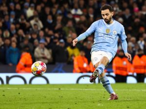 Manchester City's Portuguese midfielder #20 Bernardo Silva shoots the ball but misses to score during the penalty shootout during the UEFA Champions League quarter-final second-leg football match between Manchester City and Real Madrid, at the Etihad Stadium, in Manchester, north-west England, on April 17, 2024. (Photo by Darren Staples / AFP)