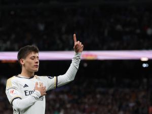 Real Madrid's Turkish midfielder #24 Arda Guler celebrates scoring his team's fourth goal during the Spanish league football match between Real Madrid CF and RC Celta de Vigo at the Santiago Bernabeu stadium in Madrid on March 10, 2024. (Photo by Pierre-Philippe MARCOU / AFP)
