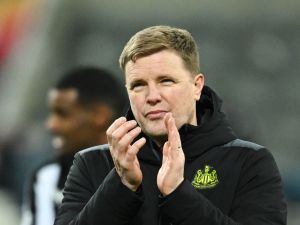 Newcastle United's English head coach Eddie Howe applauds at the end of the UEFA Champions League Group F football match between Newcastle United and AC Milan at St James' Park in Newcastle-upon-Tyne, north east England on December 13, 2023. AC Milan wins 2 - 1 against Newcastle United and qualifies for the Champions League last 16. (Photo by Paul ELLIS / AFP)