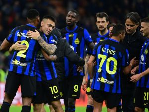 Inter Milan's players celebrate their 2-0 victory at the end of the Italian Serie A football match between Inter Milan and Empoli in Milan, on April 1, 2024. (Photo by Piero CRUCIATTI / AFP)