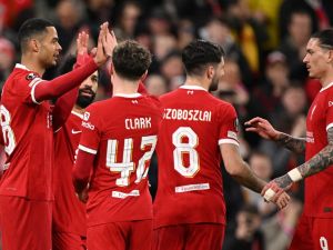 Liverpool's Dutch striker #18 Cody Gakpo (L) celebrates scoring the team's fourth goal with Liverpool's Egyptian striker #11 Mohamed Salah, Liverpool's English midfielder #42 Bobby Clark and Liverpool's Uruguayan striker #09 Darwin Nunez during the UEFA Europa League round of 16 second leg football match between Liverpool and AC Sparta Praha at Anfield in Liverpool, north west England on March 14, 2024. (Photo by Oli SCARFF / AFP)