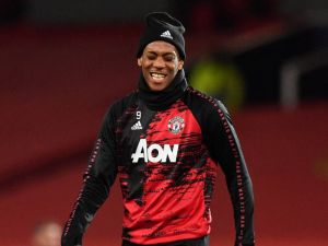 Manchester United's French striker Anthony Martial warms up ahead of the UEFA Champions league group H football match between Manchester United and RB Leipzig at Old Trafford stadium in Manchester, north west England, on October 28, 2020. / AFP / Anthony Devlin