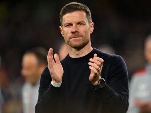 Bayer Leverkusen's Spanish head coach Xabi Alonso applauds fans on the pitch after the UEFA Europa League final football match between Atalanta and Bayer Leverkusen at the Dublin Arena stadium, in Dublin, on May 22, 2024. Atalanta won the game 3-0. (Photo by Glyn KIRK / AFP)