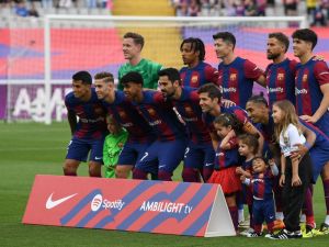 Barcelona's players pose for a team picture before the start of the Spanish League football match between FC Barcelona and Rayo Vallecano de Madrid at the Estadi Olimpic Lluis Companys in Barcelona on May 19, 2024. (Photo by MANAURE QUINTERO / AFP)