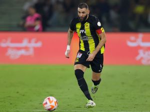 Ittihad's French forward #09 Karim Benzema runs with the ball during the Saudi Pro League football match between Al-Ittihad and Al-Nassr at King Abdullah Sports City Stadium in Jeddah on December 26, 2023. (Photo by AFP)