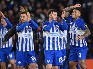 Brighton's players celebrate on the pitch after the UEFA Europa League Group B football match between Brighton and Hove Albion and Marseille at the American Express Community Stadium in Brighton, southern England on December 14, 2023. Brighton won the game 1-0 and top the Group. (Photo by Glyn KIRK / AFP)