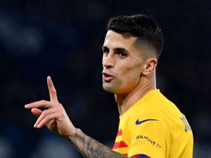 Barcelona's Portuguese defender #02 Joao Cancelo gestures during the UEFA Champions League round of 16 first Leg football match between Napoli and Barcelona at the Diego-Armando-Maradona stadium in Naples on February 21, 2024. (Photo by Tiziana FABI / AFP)