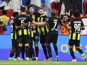 Ittihad's players celebrate their team's first goal during the Saudi Super Cup final football match between Al-Ittihad and Al-Hilal at the Mohammed bin Zayed Stadium in Abu Dhabi on April 11, 2024. (Photo by Ryan LIM / AFP)
