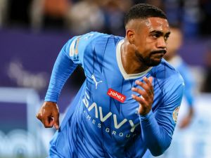 Hilal's Brazilian forward #77 Malcom reacts after scoring his team's second goal during the Saudi Pro League football match between Al-Hilal and Al-Akhdoud at the Kingdom Arena stadium in Riyadh on April 2, 2024. (Photo by Fayez NURELDINE / AFP)