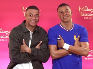 Paris Saint-Germain's French forward #07 Kylian Mbappe poses as he unveils his one-of-a-kind wax figure in Paris on May 16, 2024. Mbappe's one-of-a-kind wax figure will be taken to Berlin to be exhibited at Madame Tussauds in Berlin. (Photo by FRANCK FIFE / AFP)