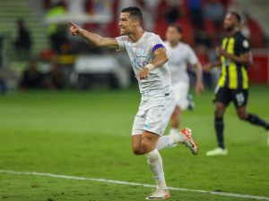 Nassr's Portuguese forward #07 Cristiano Ronaldo celebrates his second goal during the Saudi Pro League football match between Al-Ittihad and Al-Nassr at King Abdullah Sports City Stadium in Jeddah on December 26, 2023. (Photo by AFP)