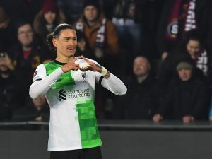 Liverpool's Uruguayan striker #09 Darwin Nunez celebrates after scoring a goal with team mates and fans during the UEFA Europa League round of 16 first leg football match between AC Sparta Praha and Liverpool FC in Prague on March 7, 2024. (Photo by MICHAL CIZEK / AFP)