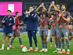 Olympiacos' players celebrate on the pitch after the UEFA Europa Conference League semi final first leg football match between Aston Villa and Olympiakos at Villa Park in Birmingham, central England, on May 2, 2024. Olympiakos won the game 4-2. (Photo by JUSTIN TALLIS / AFP)