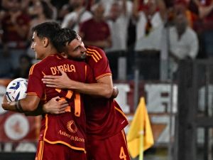 Roma's Italian midfielder #04 Bryan Cristante (R) celebrates with his teammate Roma's Argentine forward #21 Paulo Dybala after a goal during the Italian Serie A football match red between AS Roma and Empoli at the Olympic stadium in Rome on September 17, 2023. (Photo by Andreas SOLARO / AFP)