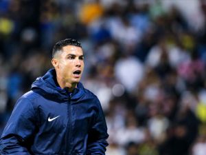 Nassr's Portuguese forward #07 Cristiano Ronaldo reacts while warming up during the Saudi Pro League football match between Damac FC and Al-Nassr FC at Prince Sultan bin Abdulaziz Sports City stadium in Abha on April 5, 2024. (Photo by Mohammed ALSHEHRI / AFP)