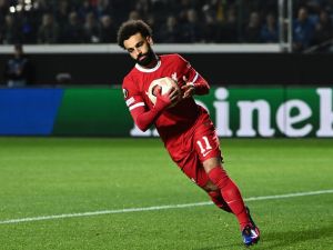 Liverpool's Egyptian forward #11 Mohamed Salah celebrates after scoring a penalty during the UEFA Europa League quarter-final second leg football match between Atalanta BC and Liverpool FC at the Atleti Azzurri d'Italia Stadium in Bergamo, on April 18, 2024. (Photo by Isabella BONOTTO / AFP)