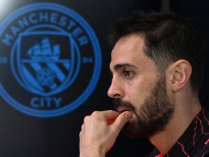 Manchester City's Portuguese midfielder #20 Bernardo Silva attends a press conference at Manchester City's training ground in north-west England on April 16, 2024, on the eve of their UEFA Champions League Group quarter-final second-leg football match against Real Madrid. (Photo by Oli SCARFF / AFP)