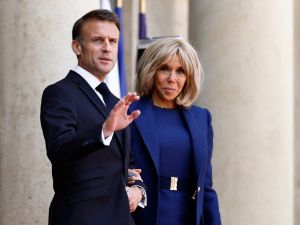 France's President Emmanuel Macron (L) and France's first lady Brigitte Macron wait upon the arrival of US President and US first lady ahead of a bilateral meeting as part of the US President's state visit to France, at the Presidential Elysee Palace in Paris on June 8, 2024. France's first lady Brigitte Macron