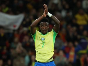 Brazil's forward #07 Vinicius Junior claps as he leaves the pitch for substitution during the international friendly football match between Spain and Brazil at the Santiago Bernabeu stadium in Madrid on March 26, 2024. Spain arranged a friendly against Brazil at the Santiago Bernabeu under the slogan "One Skin" to help combat racism. (Photo by Pierre-Philippe MARCOU / AFP)