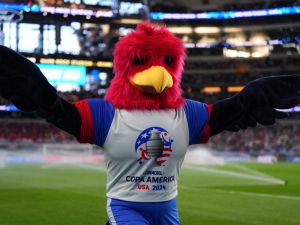 Capitan, Official mascot of Copa America 2024 gestures during the CONMEBOL Copa America 2024 Group A match between Peru and Chile at AT&T Stadium on June 21, 2024 in Arlington, Texas. Sam Hodde/Getty Images/AFP (Photo by Sam Hodde / GETTY IMAGES NORTH AMERICA / Getty Images via AFP)