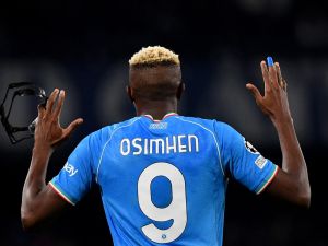 Napoli's Nigerian forward #09 Victor Osimhen celebrates after scoring a goal during the UEFA Champions League round of 16 first Leg football match between Napoli and Barcelona at the Diego-Armando-Maradona stadium in Naples on February 21, 2024. (Photo by Tiziana FABI / AFP)