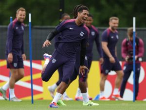 England's midfielder #10 Jude Bellingham (C) laughs during a training session at the UEFA Euro 2024 European football Championship, in Blankenhain, eastern Germany on June 15, 2024. (Photo by Adrian DENNIS / AFP)