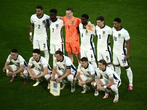England's players pose for a team photo ahead of kick-off in the UEFA Euro 2024 Group C football match between England and Slovenia at the Cologne Stadium in Cologne on June 25, 2024. (Photo by Angelos Tzortzinis / AFP)