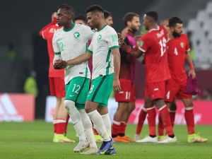 Saudi's defender Saud Abdulhamid (C-L) and Saudi's midfielder Ayman Yahya (C-R) react to their defeat in the FIFA Arab Cup 2021 group C football match between Saudi Arabia and Jordan at the Education City Stadium in the Qatari city of Ar-Rayyan on December 1, 2021. (Photo by KARIM JAAFAR / AFP)
