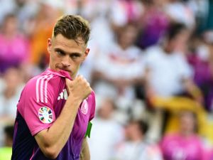 Germany's defender #06 Joshua Kimmich celebrates after winning the UEFA Euro 2024 Group A football match between Germany and Hungary at the Stuttgart Arena in Stuttgart on June 19, 2024. (Photo by Tobias SCHWARZ / AFP)