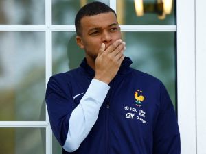 French forward Kylian Mbappe waits for the arrival of French President for a lunch at the team's training camp, as part of the team's preparation for the UEFA Euro 2024 European football championships in Clairefontaine-en-Yvelines on June 3, 2024. (Photo by Sarah Meyssonnier / POOL / AFP)