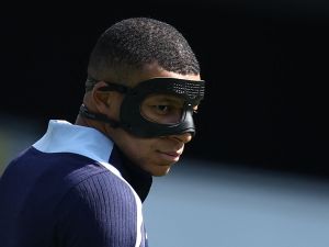 France's forward #10 Kylian Mbappe, wearing a protective mask, takes part in a MD-1 training session at the Home Deluxe Arena Stadium in Paderborn, western Germany, on June 24, 2024, on the eve of their UEFA Euro 2024 Group D football match against Poland. (Photo by FRANCK FIFE / AFP)