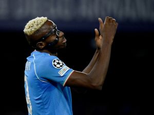 Napoli's Nigerian forward #09 Victor Osimhen reacts during the UEFA Champions League round of 16 first Leg football match between Napoli and Barcelona at the Diego-Armando-Maradona stadium in Naples on February 21, 2024. (Photo by Filippo MONTEFORTE / AFP)