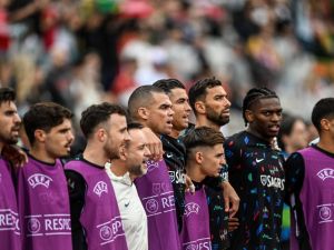 Portugal's players listen to the national anthem before the start of the international friendly football match between Portugal and Croatia at Jamor stadium in Oeiras on June 8, 2024. (Photo by PATRICIA DE MELO MOREIRA / AFP)