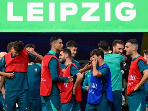 Portugal's players including Portugal's forward #07 Cristiano Ronaldo (C) arrive for the MD-1 training session at the Leipzig Stadium in Leipzig, eastern Germany on June 17, 2024, on the eve of their UEFA Euro 2024 Group F football match against the Czech Republic. (Photo by JOHN MACDOUGALL / AFP)