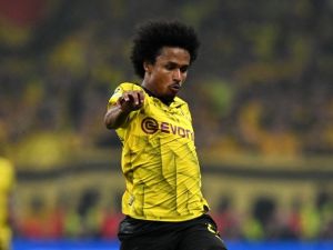 Dortmund's German forward #27 Karim Adeyemi runs with the ball during the UEFA Champions League final football match between Borussia Dortmund and Real Madrid, at Wembley stadium, in London, on June 1, 2024. (Photo by Glyn KIRK / AFP)