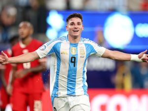 Argentina's forward #09 Julian Alvarez celebrates scoring his team's first goal during the Conmebol 2024 Copa America tournament semi-final football match between Argentina and Canada at MetLife Stadium, in East Rutherford, New Jersey on July 9, 2024. (Photo by CHARLY TRIBALLEAU / AFP)