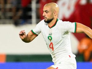 Morocco's midfielder #4 Sofyan Amrabat runs with the ball during the Africa Cup of Nations (CAN) 2024 group F football match between Zambia and Morocco at the Stade Laurent Pokou in San Pedro on January 24, 2024. (Photo by SIA KAMBOU / AFP)
