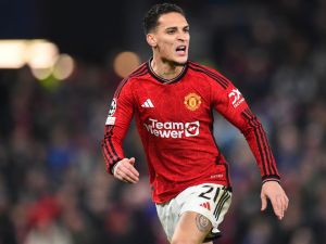 Manchester United's Brazilian midfielder #21 Antony reacts during the UEFA Champions League group A football match between Manchester United and FC Bayern Munich at Old Trafford stadium in Manchester, north west England, on December 12, 2023. (Photo by PETER POWELL / AFP)
