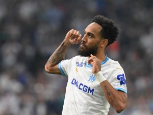 Marseille's French-Gabonese forward #10 Pierre-Emerick Aubameyang celebrates scoring his team's third goal during the French L1 football match between Olympique Marseille (OM) and FC Lorient at the Stade Velodrome in Marseille, southern France, on May 12, 2024. (Photo by Nicolas TUCAT / AFP)
