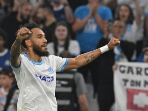 Marseille's French-Gabonese forward #10 Pierre-Emerick Aubameyang celebrates after scoring his team's first goal during the French L1 football match between Olympique Marseille (OM) and FC Lorient at the Stade Velodrome in Marseille, southern France, on May 12, 2024. (Photo by Nicolas TUCAT / AFP)