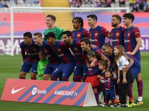 Barcelona's players pose for a team picture before the start of the Spanish League football match between FC Barcelona and Rayo Vallecano de Madrid at the Estadi Olimpic Lluis Companys in Barcelona on May 19, 2024. (Photo by MANAURE QUINTERO / AFP)