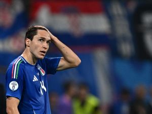 Italy's forward #14 Federico Chiesa reacts during the UEFA Euro 2024 Group B football match between Croatia and Italy at the Leipzig Stadium in Leipzig on June 24, 2024. (Photo by GABRIEL BOUYS / AFP)