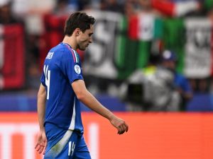 Italy's forward #14 Federico Chiesa reacts at the end of the UEFA Euro 2024 round of 16 football match between Switzerland and Italy at the Olympiastadion Berlin in Berlin on June 29, 2024. (Photo by Kirill KUDRYAVTSEV / AFP)